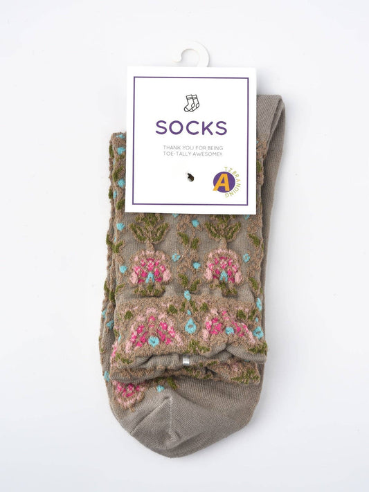 Vintage floral socks worn with boots — mid-calf length fall layering